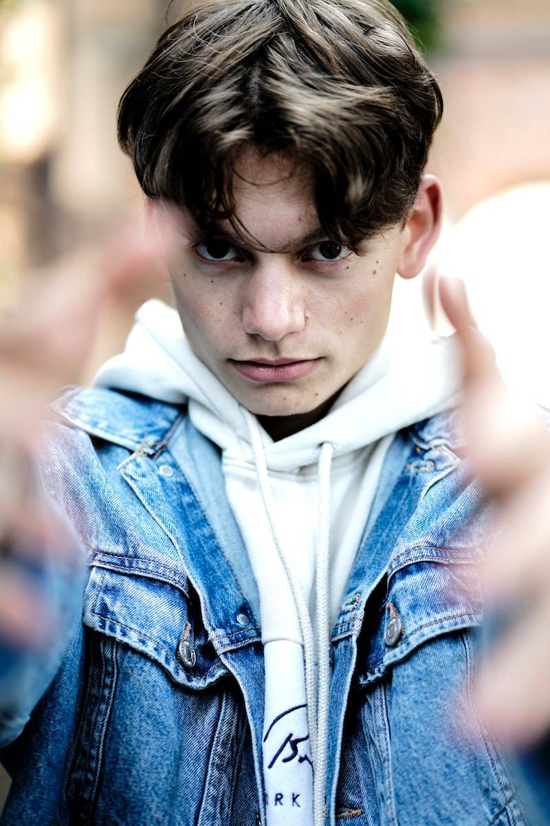 man in blue denim jacket